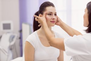 Dermatologist Examining Female Patient